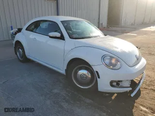 2012 Volkswagen Beetle 2.5L with VIN 3VWJX7AT1CM663786, listed as a Copart auction lot 73893424 with 34,626 mi miles and Salvage Title. Bid and sale history available at carsss.com. Image 4.