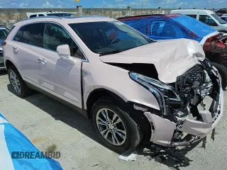 2023 Cadillac XT5 FWD Premium Luxury z VIN 1GYKNCR45PZ160005, wystawiony jako Copart lot #59147325 z przebiegiem 70 322 mil mil oraz Szkoda całkowita • Salvage title. Historia ofert i sprzedaży dostępna na DreamBid. Obrazek 4.