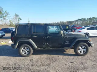2007 Jeep Wrangler Unlimited X with VIN 1J4GA39127L159095, listed as a IAAI auction lot 41780974 with 179,791 mi miles. Bid and sale history available at carsss.com. Image 13.