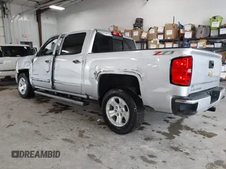 2017 Chevrolet Silverado 1500 LT with VIN 3GCUKREC2HG473554, listed as a IAAI auction lot 42220143 with 80,000 mi miles and . Bid and sale history available at DreamBid. Image 3.