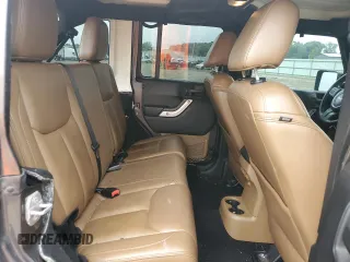 2014 Jeep Wrangler Unlimited Sahara with VIN 1C4HJWEG7EL299548, listed as a Copart auction lot 58522355 with 76,057 mi miles and Clean title. Bid and sale history available at DreamBid. Image 11.