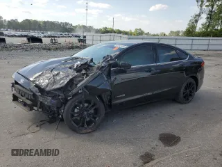 2017 Ford Fusion Hybrid SE z VIN 3FA6P0LUXHR315815, wystawiony jako Copart lot #53942405 z przebiegiem Nie podano mil oraz Szkoda całkowita • Salvage title. Historia ofert i sprzedaży dostępna na DreamBid. Obrazek 1.