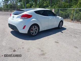 2016 Hyundai Veloster with VIN KMHTC6AD3GU270895, listed as a IAAI auction lot 42139765 with 138,884 mi miles. Bid and sale history available at carsss.com. Image 4.