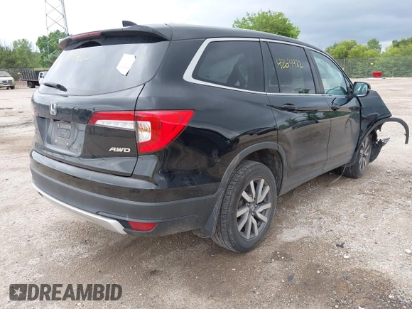 2020 Honda Pilot EX-L with VIN 5FNYF6H57LB059332, listed as a IAAI auction lot 42614422 with 110,279 mi miles and . Bid and sale history available at DreamBid. Image 4.