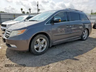 2013 Honda Odyssey Touring with VIN 5FNRL5H97DB087661, listed as a Copart auction lot 58368605 with 201,590 mi miles and Salvage title. Bid and sale history available at DreamBid. Image 1.
