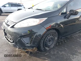 2013 Ford Fiesta S z VIN 3FADP4AJ7DM178265, wystawiony jako IAAI lot #41610346 z przebiegiem 115 963 mil mil oraz . Historia ofert i sprzedaży dostępna na DreamBid. Obrazek 6.