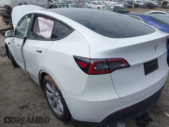 2023 Tesla Model Y Long Range with VIN 7SAYGDEE2PA145398, listed as a IAAI auction lot 41546573 with 20,812 mi miles and . Bid and sale history available at carsss.com. Image 3.