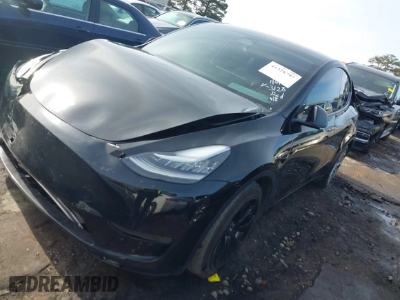 2023 Tesla Model Y Long Range z VIN 7SAYGAEE5PF603128, wystawiony jako IAAI lot #41328797 z przebiegiem 63 527 mil mil oraz . Historia ofert i sprzedaży dostępna na DreamBid. Obrazek 20.