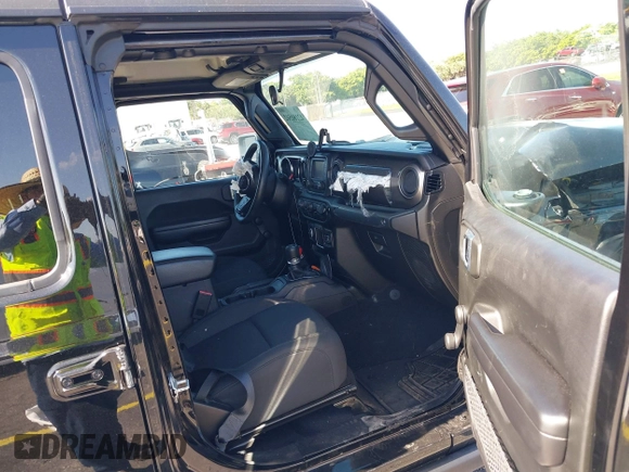 2021 Jeep Gladiator Willys with VIN 1C6HJTAGXML613431, listed as a IAAI auction lot 42180502 with 64,572 mi miles and . Bid and sale history available at DreamBid. Image 4.