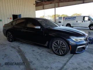 2019 BMW 7 Series M760i xDrive with VIN WBA7H6C55KG614986, listed as a Copart auction lot 84023164 with 59,222 mi miles and Non Repairable. Bid and sale history available at carsss.com. Image 4.