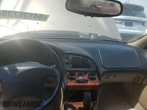 1999 Chrysler Sebring LXi with VIN 4C3AU52N1XE071836, listed as a Copart auction lot 54136735 with 151,531 mi miles and Salvage Title. Bid and sale history available at DreamBid. Image 8.