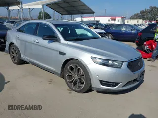 2014 Ford Taurus SHO with VIN 1FAHP2KT8EG123342, listed as a IAAI auction lot 42095390 with 142,957 mi miles. Bid and sale history available at carsss.com. Image 1.