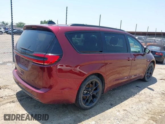 2023 Chrysler Pacifica Touring L with VIN 2C4RC1BG7PR513017, listed as a IAAI auction lot 42441272 with 23,310 mi miles and . Bid and sale history available at DreamBid. Image 4.