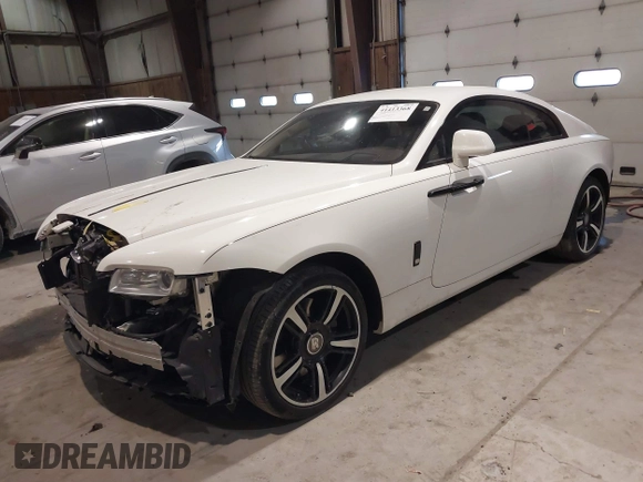 2014 Rolls-Royce Wraith z VIN SCA665C59EUX84389, wystawiony jako IAAI lot #41413368 z przebiegiem 57 951 mil mil oraz . Historia ofert i sprzedaży dostępna na DreamBid. Obrazek 18.