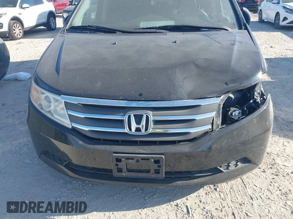 2012 Honda Odyssey EX-L with VIN 5FNRL5H6XCB016801, listed as a IAAI auction lot 42112141 with 164,671 mi miles and . Bid and sale history available at carsss.com. Image 6.