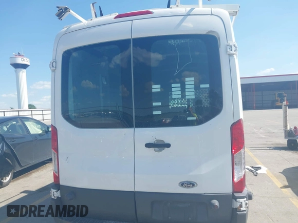2015 Ford Transit Cargo z VIN 1FTNR2CG1FKB04641, wystawiony jako IAAI lot #42642710 z przebiegiem 136 892 mil mil oraz . Historia ofert i sprzedaży dostępna na DreamBid. Obrazek 16.