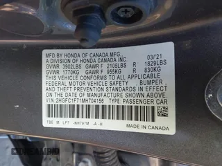2021 Honda Civic Sedan EX-L with VIN 2HGFC1F71MH704156, listed as a IAAI auction lot 41339459 with 30,120 mi miles. Bid and sale history available at carsss.com. Image 9.