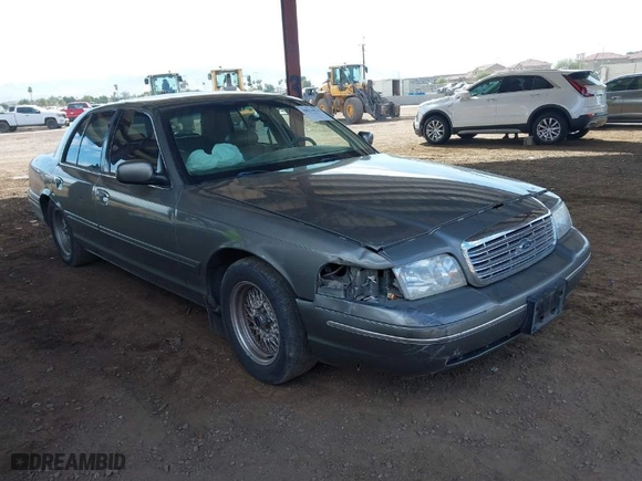 1999 Ford Crown Victoria LX with VIN 2FAFP74W9XX233325, listed as a IAAI auction lot 40934834 with 176,845 mi miles. Bid and sale history available at carsss.com. Image 1.