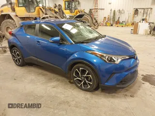 2019 Toyota C-HR XLE with VIN JTNKHMBX0K1042342, listed as a IAAI auction lot 41935879 with 54,190 mi miles. Bid and sale history available at carsss.com. Image 1.