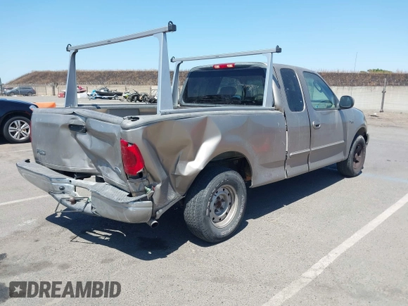 2002 Ford F-150 XL with VIN 1FTRX17272KE07014, listed as a IAAI auction lot 42381725 with 212,294 mi miles and . Bid and sale history available at DreamBid. Image 4.