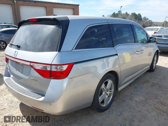 2012 Honda Odyssey Touring with VIN 5FNRL5H92CB108690, listed as a IAAI auction lot 41826580 with 150,327 mi miles and . Bid and sale history available at DreamBid. Image 4.