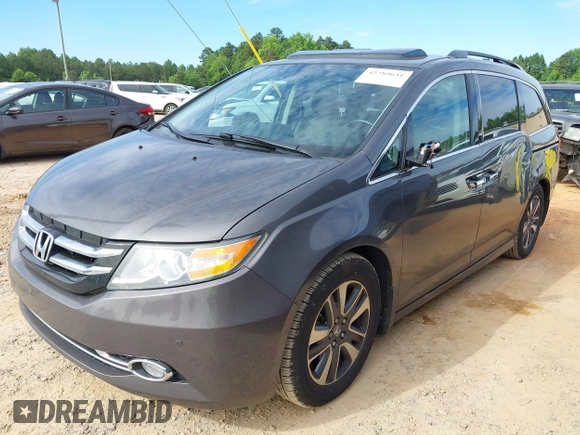 2015 Honda Odyssey Touring Elite z VIN 5FNRL5H97FB060981, wystawiony jako IAAI lot #42289631 z przebiegiem 160 947 mil mil oraz . Historia ofert i sprzedaży dostępna na DreamBid. Obrazek 19.