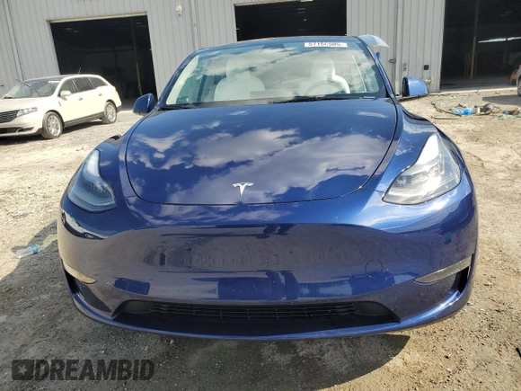 2023 Tesla Model Y Long Range z VIN 7SAYGDEE3PA178832, wystawiony jako Copart lot #57156005 z przebiegiem 12 920 mil mil oraz Szkoda całkowita • Salvage title. Historia ofert i sprzedaży dostępna na DreamBid. Obrazek 5.