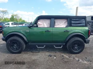 2023 Ford Bronco with VIN 1FMEE5DP0PLB80676, listed as a IAAI auction lot 42210054 with 6,796 mi miles and . Bid and sale history available at DreamBid. Image 13.