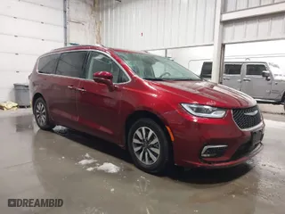 2021 Chrysler Pacifica Hybrid Touring L with VIN 2C4RC1L71MR581260, listed as a IAAI auction lot 42014401 with 68,719 mi miles. Bid and sale history available at carsss.com. Image 1.