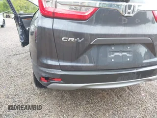 2018 Honda CR-V EX z VIN 7FARW2H50JE094132, wystawiony jako IAAI lot #42337889 z przebiegiem 59 273 mil mil oraz . Historia ofert i sprzedaży dostępna na DreamBid. Obrazek 21.