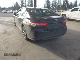 2020 Toyota Camry LE with VIN 4T1C11AKXLU363530, listed as a IAAI auction lot 41670307 with 86,459 mi miles. Bid and sale history available at carsss.com. Image 3.