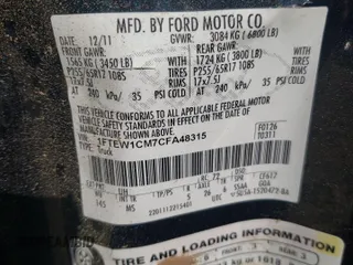 2012 Ford F-150 XL with VIN 1FTEW1CM7CFA48315, listed as a Copart auction lot 50259085 with 242,761 mi miles and Salvage Title. Bid and sale history available at carsss.com. Image 14.