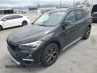 2017 BMW X1 sDrive28i z VIN WBXHU7C33H5H37946, wystawiony jako Copart lot #53853445 z przebiegiem 95 943 mil mil oraz Szkoda całkowita • Salvage title. Historia ofert i sprzedaży dostępna na DreamBid. Obrazek 1.