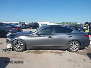 2014 Infiniti Q50 Hybrid Premium with VIN JN1AV7AP4EM691014, listed as a IAAI auction lot 41984130 with 114,230 mi miles and . Bid and sale history available at DreamBid. Image 14.