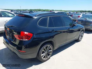 2014 BMW X1 sDrive28i with VIN WBAVM1C5XEVW51666, listed as a IAAI auction lot 42083936 with 176,465 mi miles. Bid and sale history available at carsss.com. Image 4.