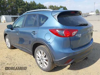 2015 Mazda CX-5 Grand Touring with VIN JM3KE4DY5F0469098, listed as a IAAI auction lot 41858792 with 174,883 mi miles. Bid and sale history available at carsss.com. Image 3.