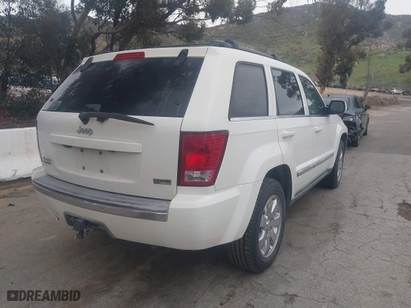2009 Jeep Grand Cherokee Limited with VIN 1J8HR58P39C547341, listed as a IAAI auction lot 41792437 with 147,260 mi miles. Bid and sale history available at carsss.com. Image 4.
