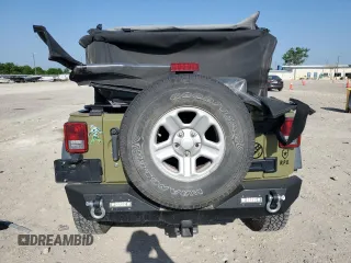 2013 Jeep Wrangler Sport with VIN 1C4AJWAG3DL649487, listed as a Copart auction lot 52568285 with 106,644 mi miles and Salvage title. Bid and sale history available at DreamBid. Image 6.