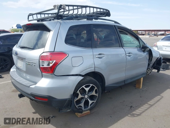 2014 Subaru Forester XT Touring with VIN JF2SJGPC2EH458390, listed as a IAAI auction lot 41923959 with 113,170 mi miles and . Bid and sale history available at DreamBid. Image 4.