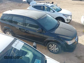 2014 Dodge Journey SE with VIN 3C4PDCAB7ET170340, listed as a IAAI auction lot 42078834 with 215,084 mi miles and . Bid and sale history available at carsss.com. Image 1.