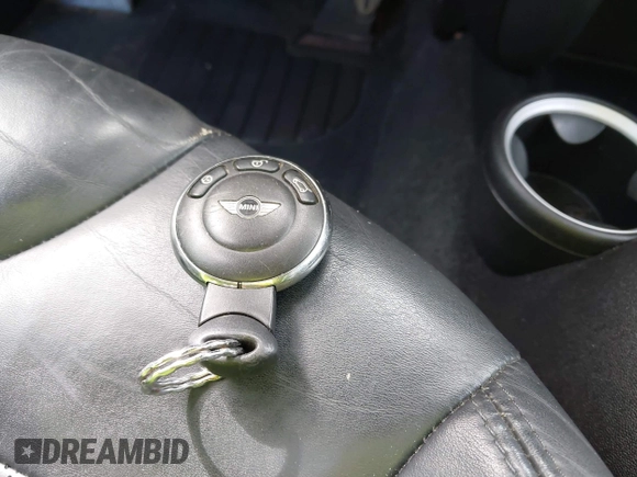 2007 MINI Hardtop S with VIN WMWMF73537TL88038, listed as a IAAI auction lot 42200252 with 70,603 mi miles and . Bid and sale history available at DreamBid. Image 11.