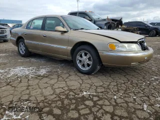 1999 Lincoln Continental with VIN 1LNHM97V2XY644250, listed as a Copart auction lot 82440454 with 196,568 mi miles and Clean Title. Bid and sale history available at carsss.com. Image 4.