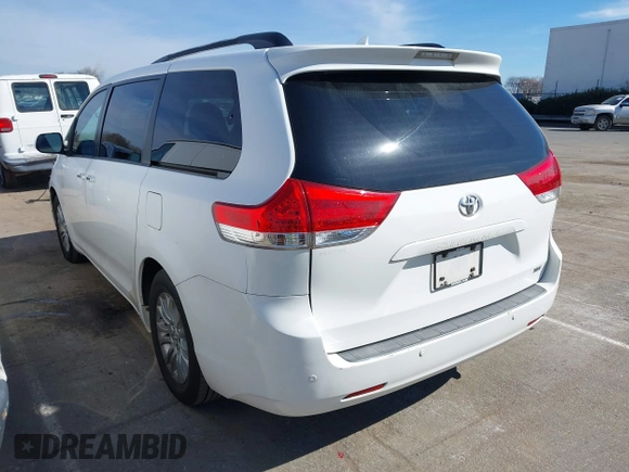 2011 Toyota Sienna XLE AAS with VIN 5TDYK3DCXBS043733, listed as a IAAI auction lot 41601544 with 221,658 mi miles and . Bid and sale history available at DreamBid. Image 3.