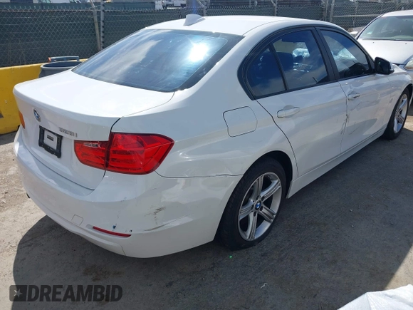 2015 BMW 3 Series 328i with VIN WBA3A5G51FNS89956, listed as a IAAI auction lot 42012575 with 121,246 mi miles. Bid and sale history available at carsss.com. Image 4.