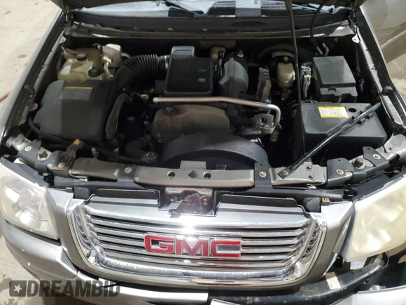 2007 GMC Envoy SLE z VIN 1GKDT13S172268778, wystawiony jako Copart lot #86169804 z przebiegiem 109 164 mil mil oraz Szkoda całkowita • Salvage title. Historia ofert i sprzedaży dostępna na DreamBid. Obrazek 12.