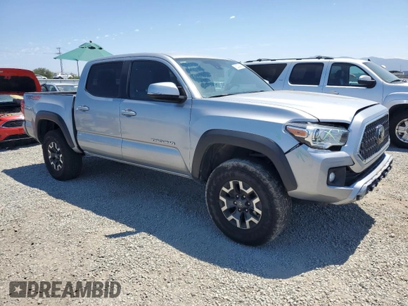 2018 Toyota Tacoma SR with VIN 3TMCZ5AN6JM129370, listed as a Copart auction lot 63042425 with 65,189 mi miles and Salvage title. Bid and sale history available at DreamBid. Image 4.