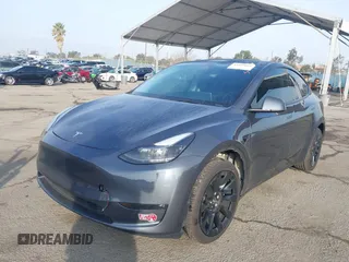 2023 Tesla Model Y Long Range with VIN 7SAYGDEE7PA196038, listed as a IAAI auction lot 41459601 with 16,489 mi miles and . Bid and sale history available at DreamBid. Image 17.