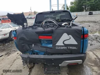 2023 Rivian R1T Adventure with VIN 7FCTGBAA5PN026063, listed as a Copart auction lot 66916194 with 0 mi miles and Salvage Title. Bid and sale history available at carsss.com. Image 6.