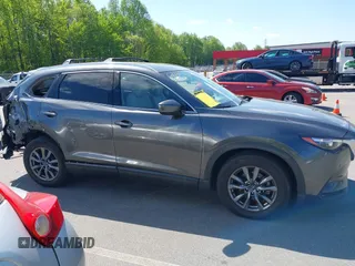 2021 Mazda CX-9 Touring with VIN JM3TCACY7M0503484, listed as a IAAI auction lot 42013262 with 63,777 mi miles and . Bid and sale history available at DreamBid. Image 14.