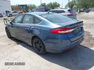 2018 Ford Fusion Hybrid SE with VIN 3FA6P0LU9JR137983, listed as a IAAI auction lot 42087894 with 196,330 mi miles. Bid and sale history available at carsss.com. Image 3.